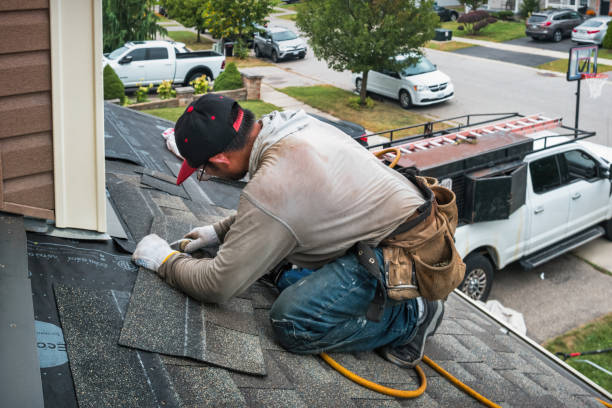 Professional Storm Damage Roof Repair technician working in Elgin, TX